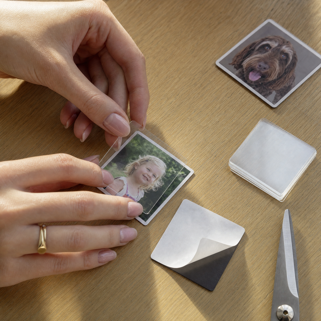 The simple home assembly of a square photo magnet